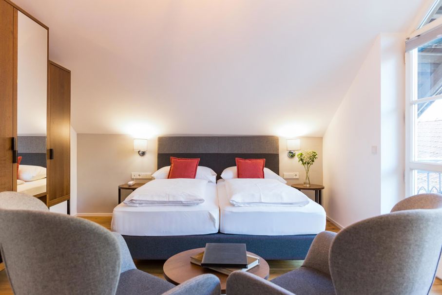 The bedroom with a double bed of one of the Suites