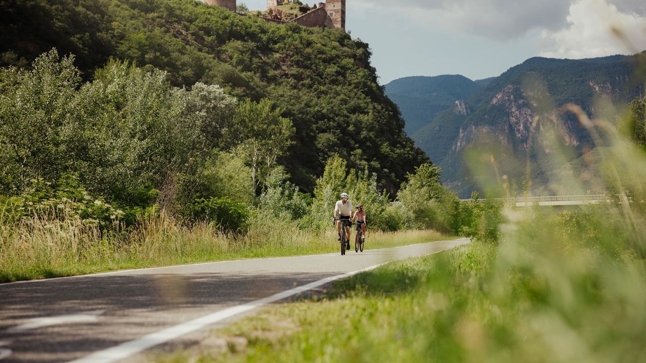 Two people on a bike path